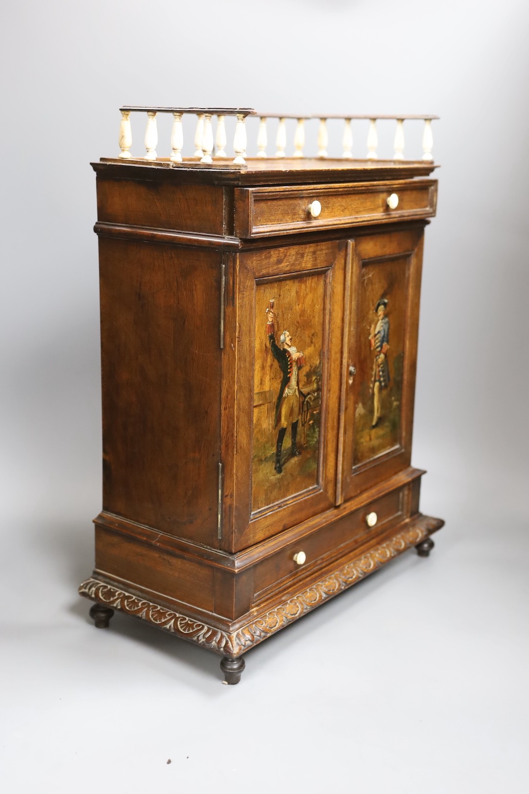 A 19th century walnut cigar cabinet, with an ivory and bone gallery., 6 cms wide x 45 cms high.